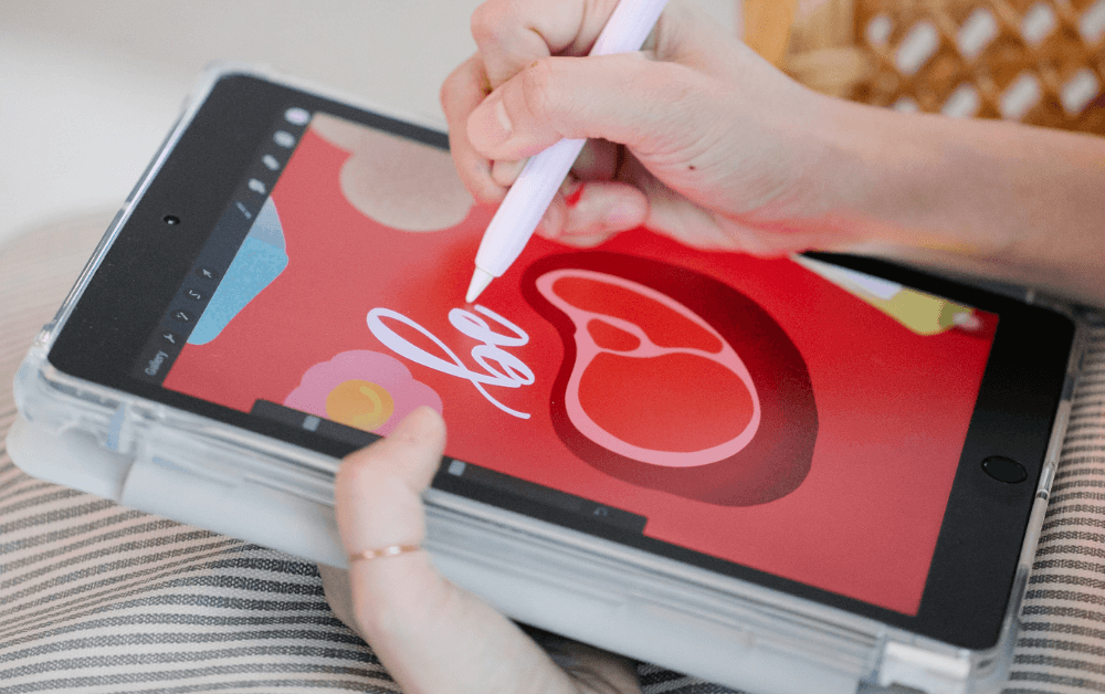 Person creating digital art using graphics tablet